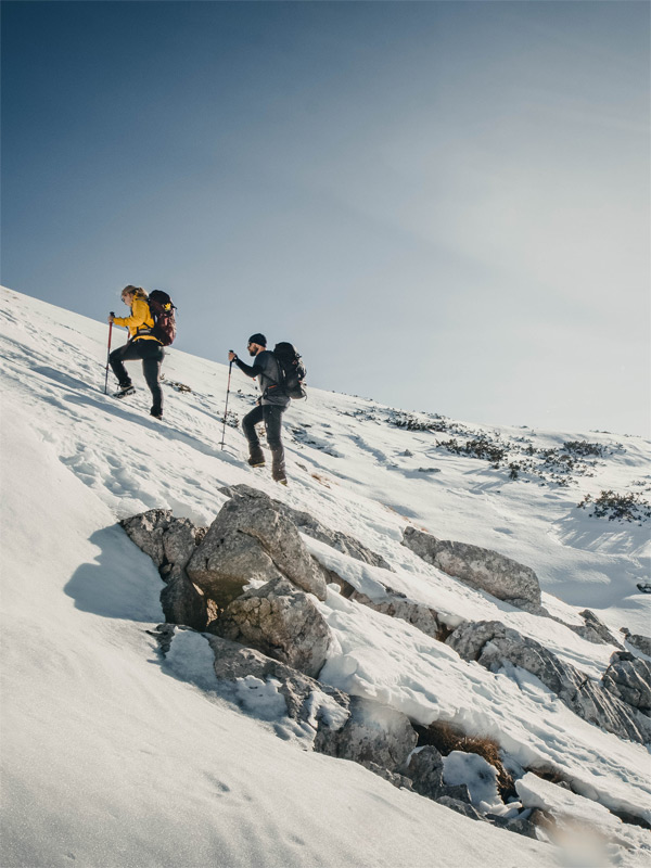 Hike towards peak Sv.Brdo on Velebit mountain during winter snow