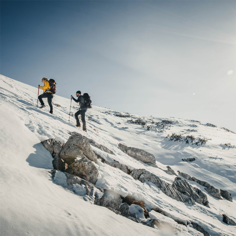 Hike towards peak Sv.Brdo on Velebit mountain during winter snow